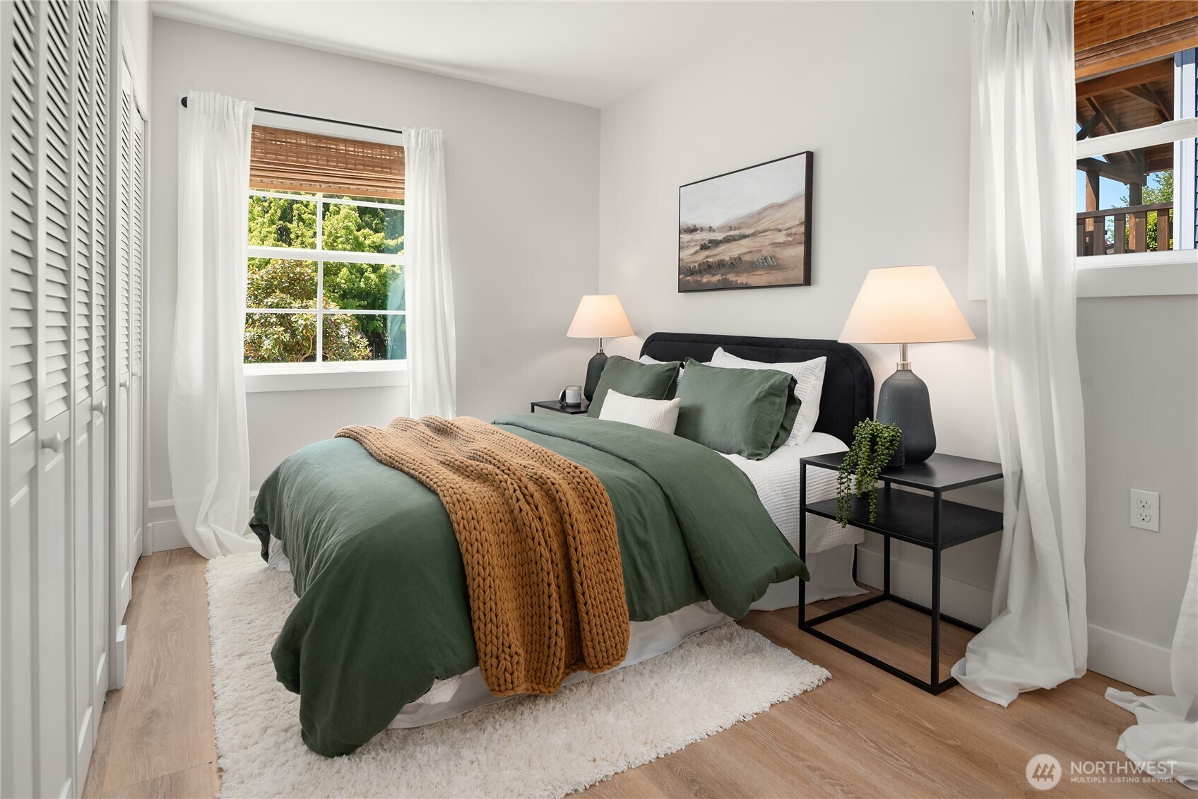 5648 38th Avenue Southwest Seattle, WA 98126 - Photo 33 of 40 a bedroom with a bed and window