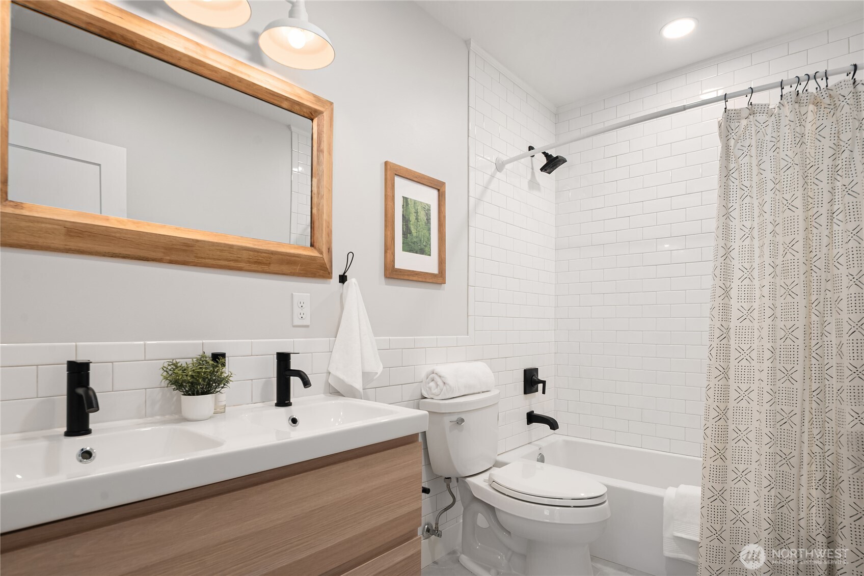 5648 38th Avenue Southwest Seattle, WA 98126 - Photo 34 of 40 a white toilet sitting next to a bathroom sink