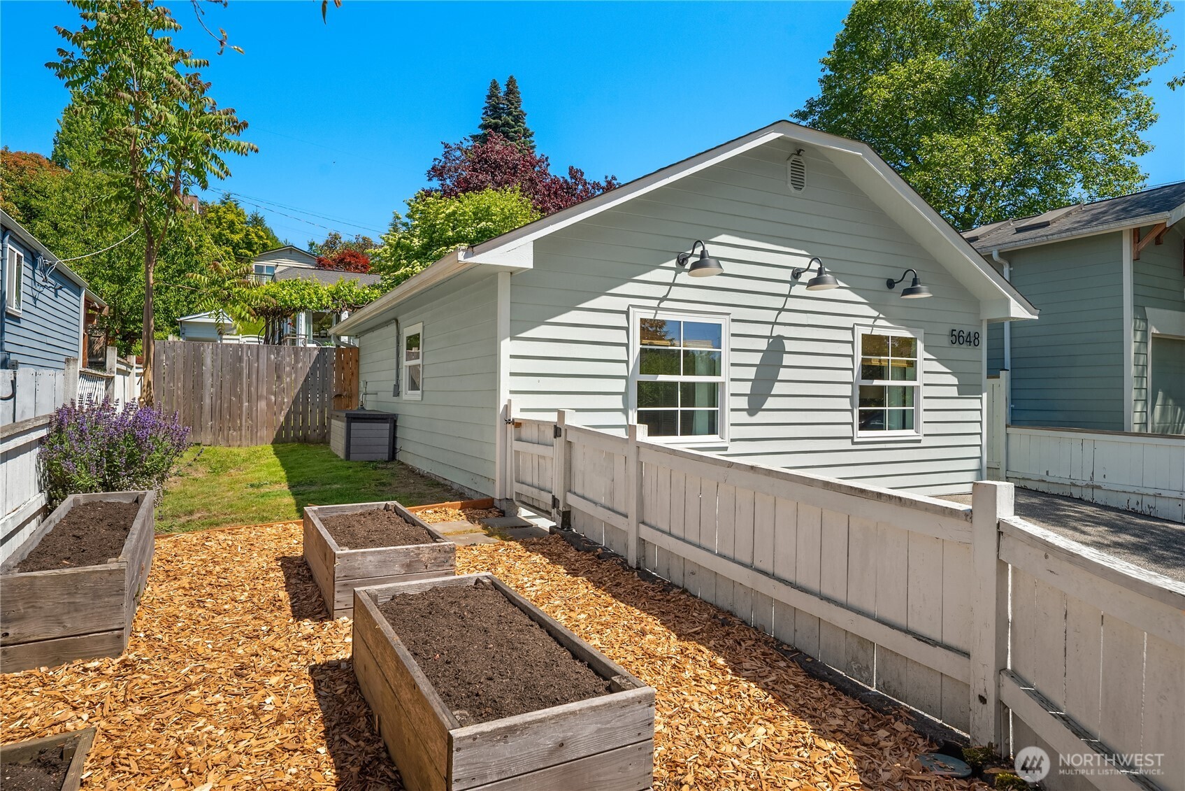 5648 38th Avenue Southwest Seattle, WA 98126 - Photo 36 of 40 a front view of a house with garden
