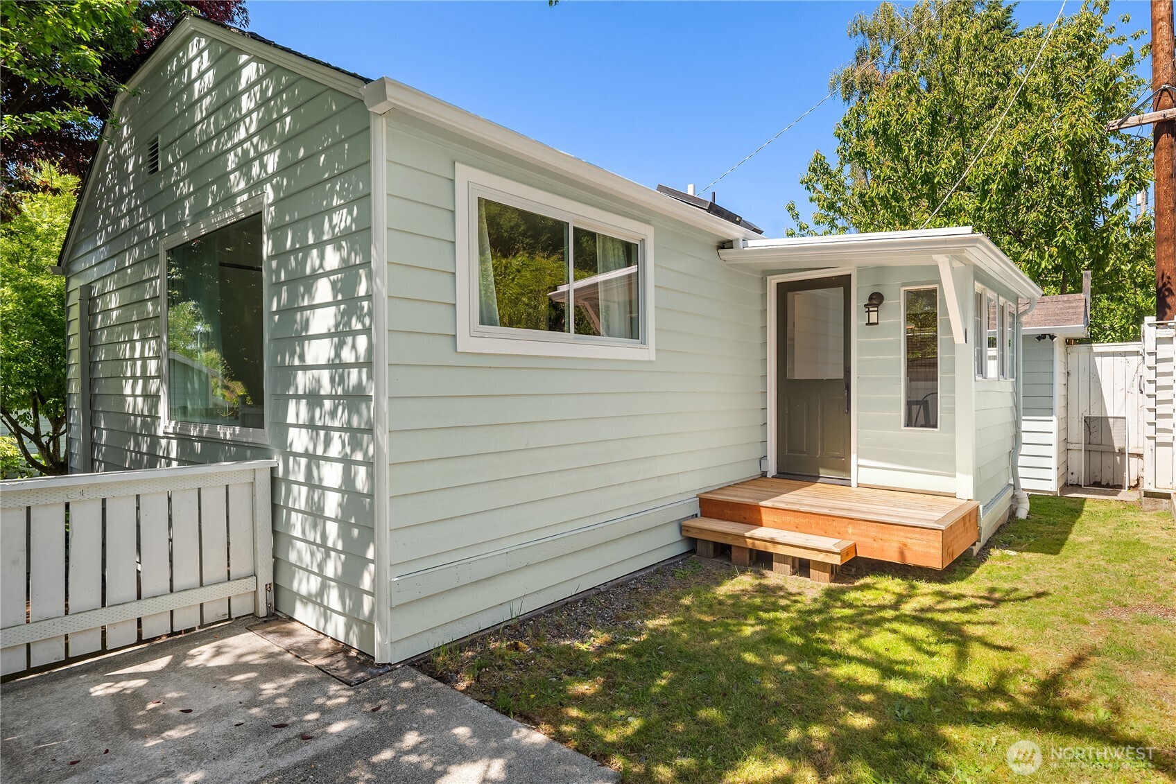 5648 38th Avenue Southwest Seattle, WA 98126 - Photo 38 of 40 a backyard of a house with a tree