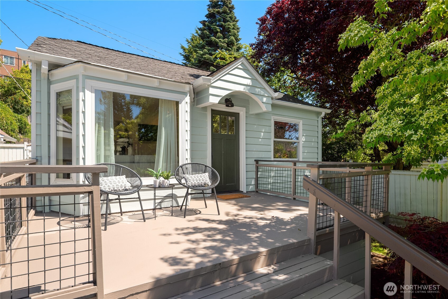 5648 38th Avenue Southwest Seattle, WA 98126 - Photo 4 of 40 a view of a house with backyard and sitting area