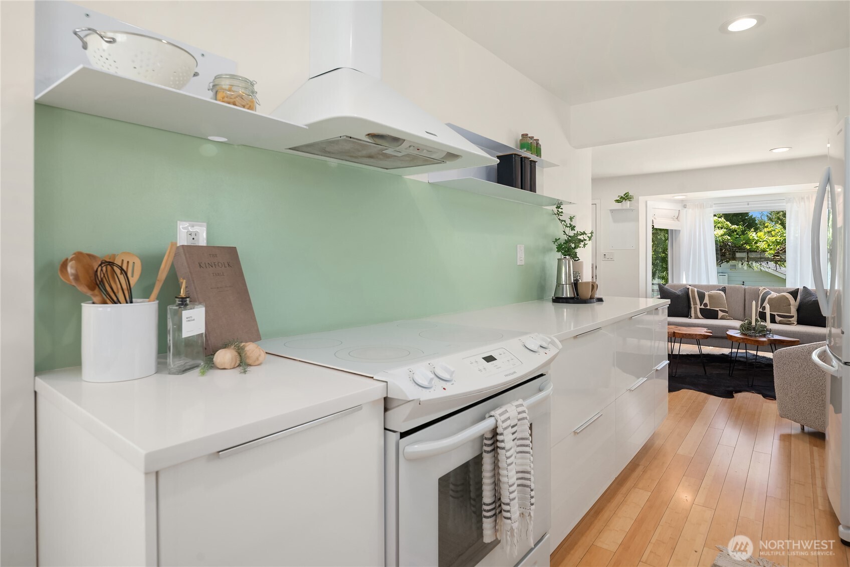 5648 38th Avenue Southwest Seattle, WA 98126 - Photo 9 of 40 a kitchen with a stove and a microwave
