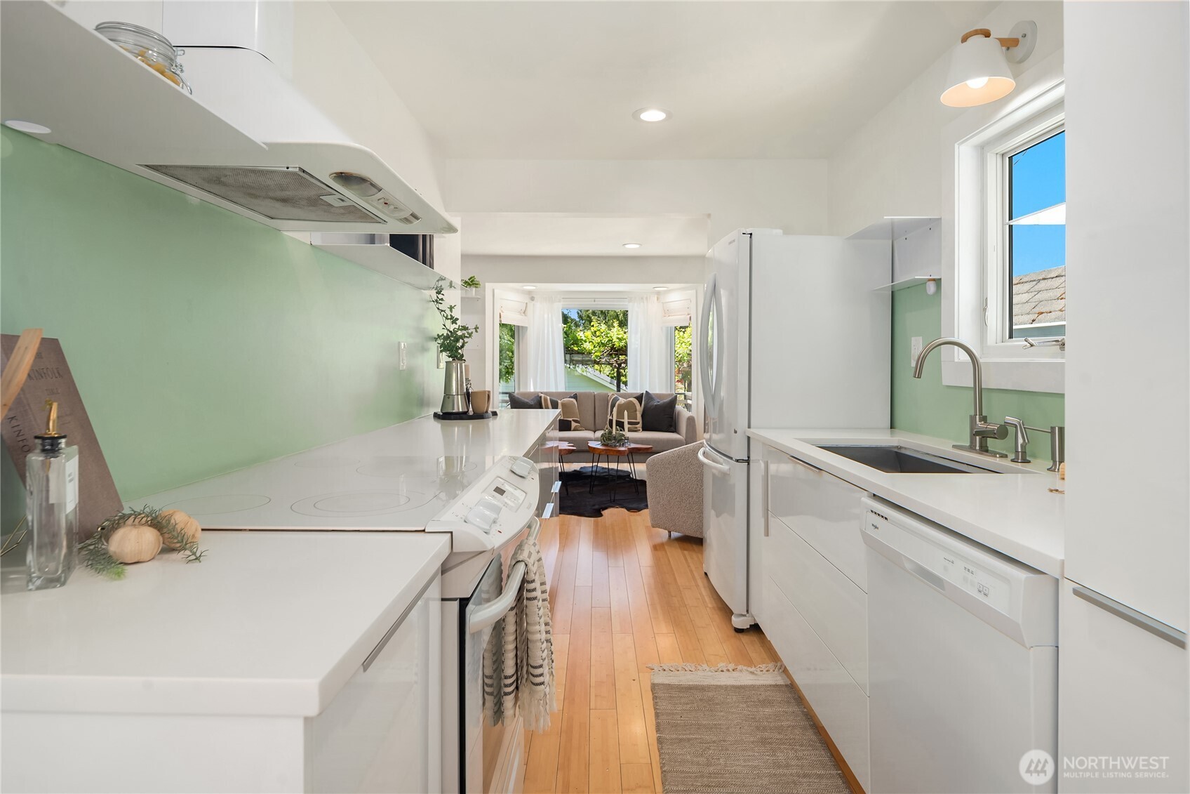 5648 38th Avenue Southwest Seattle, WA 98126 - Photo 10 of 40 a kitchen with a sink appliances and cabinets