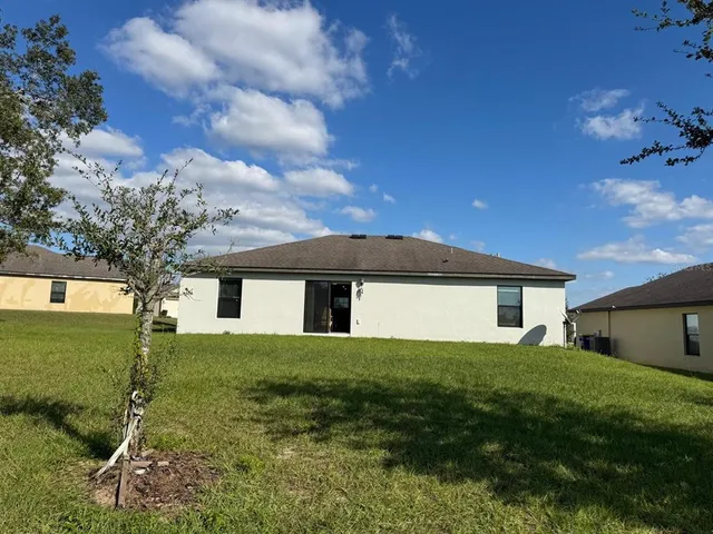 a view of a house with a big yard