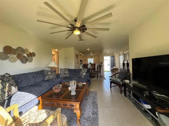 a kitchen with a refrigerator and a sink