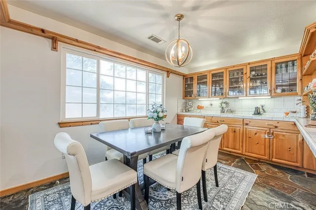 a view of a porch with furniture and garden