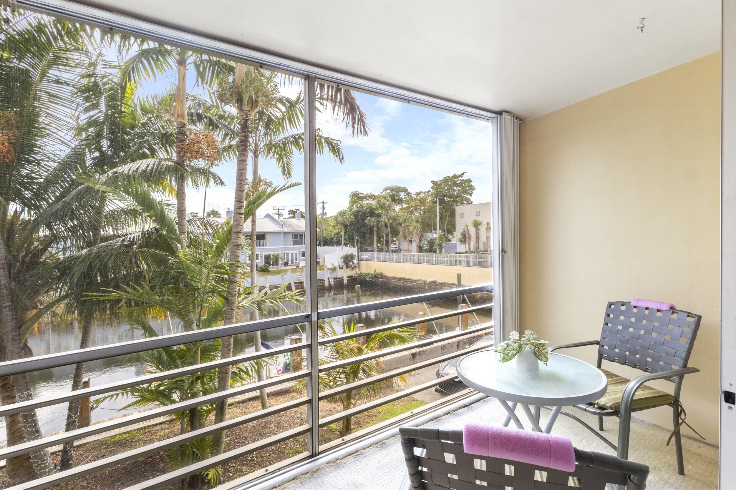 4500 North Federal Highway, Unit 272H Lighthouse Point, FL 33064 - Photo 14 of 30 a view of a room with furniture and a large window