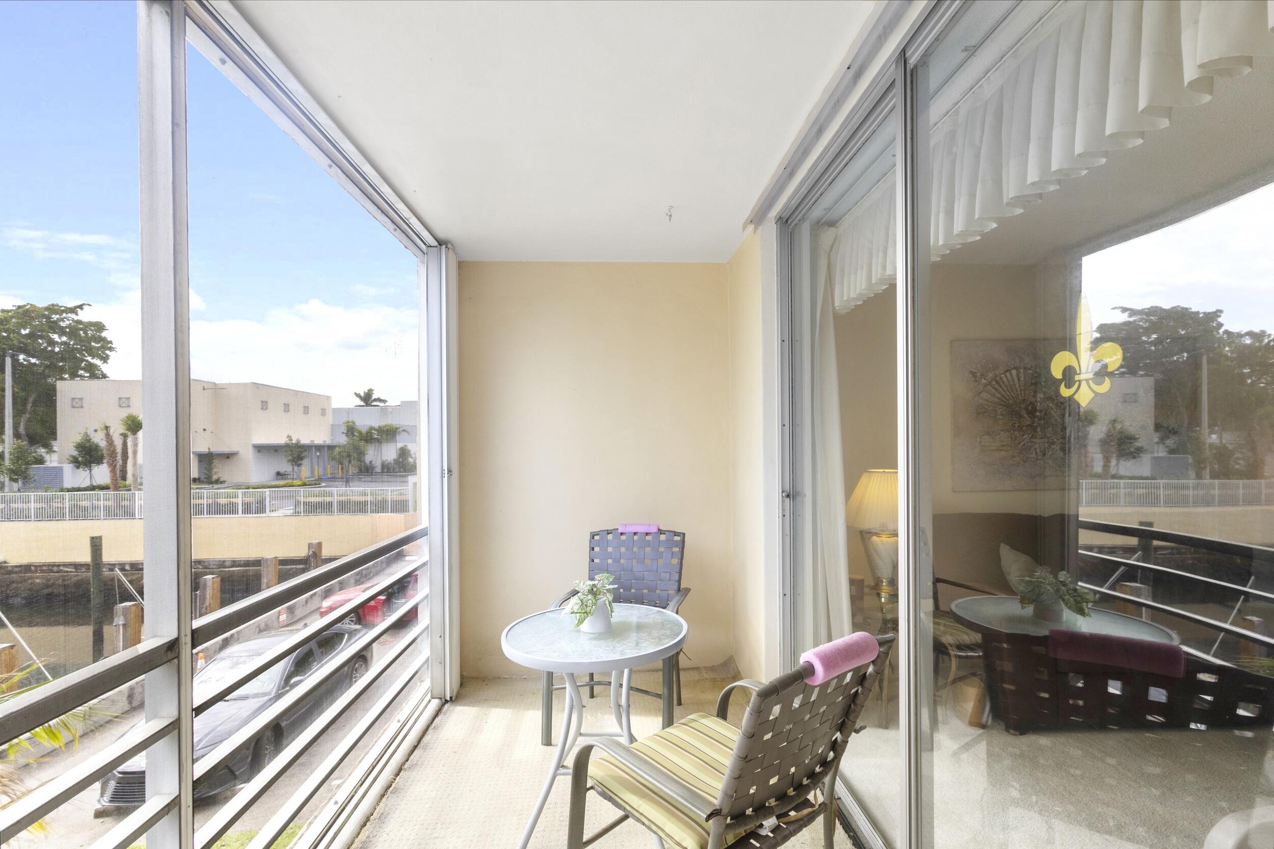 4500 North Federal Highway, Unit 272H Lighthouse Point, FL 33064 - Photo 15 of 30 a room with furniture and a window