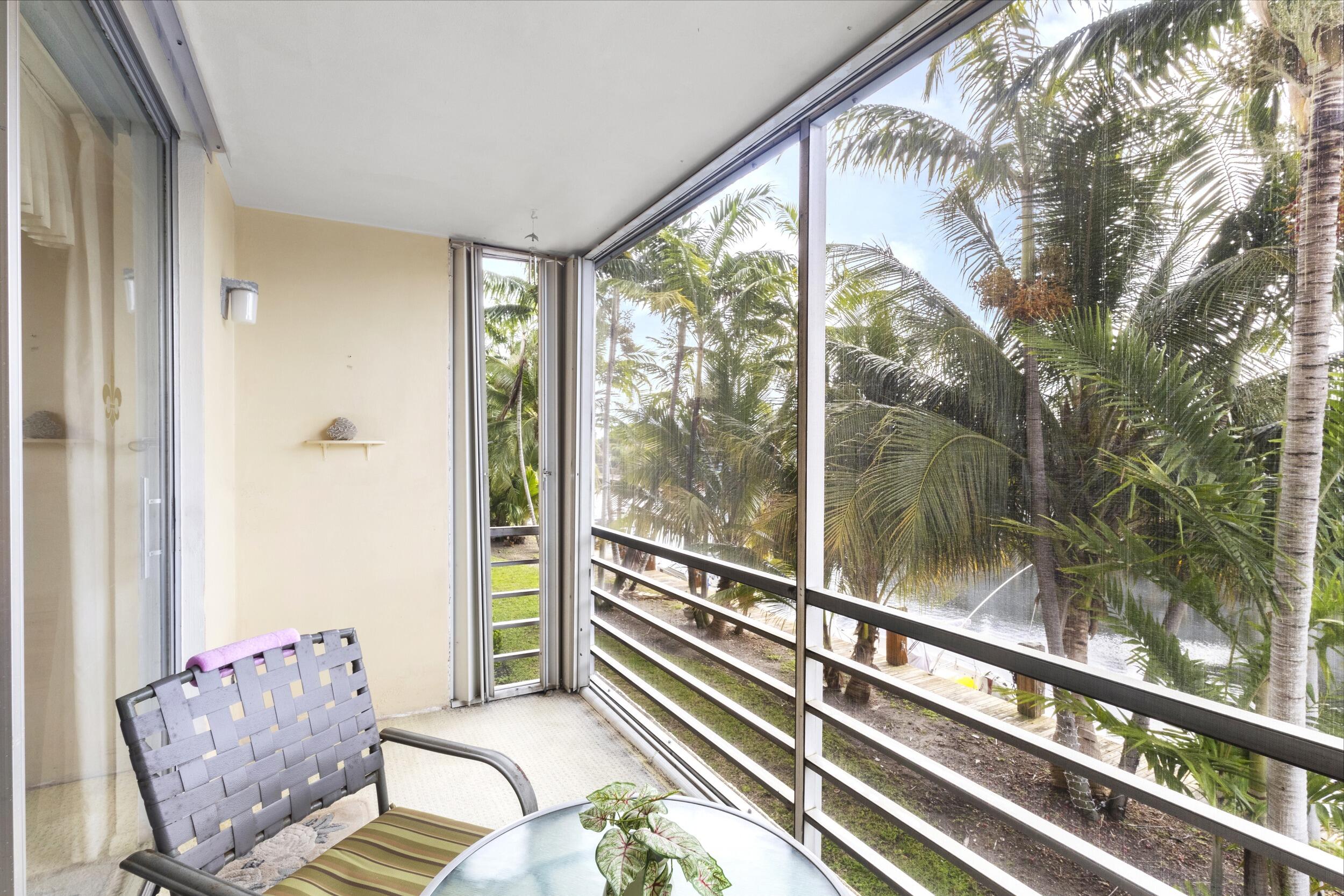 4500 North Federal Highway, Unit 272H Lighthouse Point, FL 33064 - Photo 17 of 30 a living room with furniture and a large window