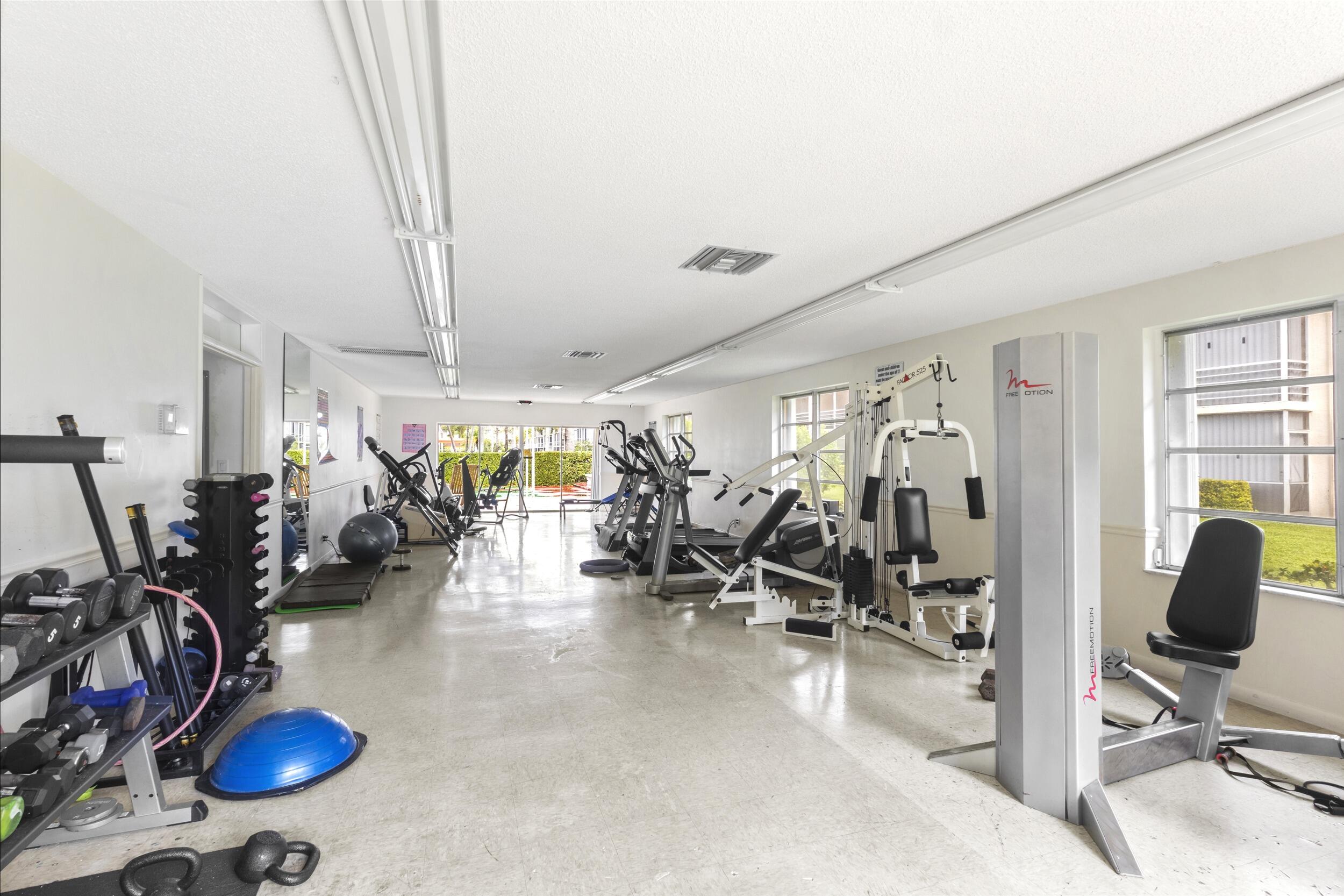 4500 North Federal Highway, Unit 272H Lighthouse Point, FL 33064 - Photo 20 of 30 a view of a room with gym equipment
