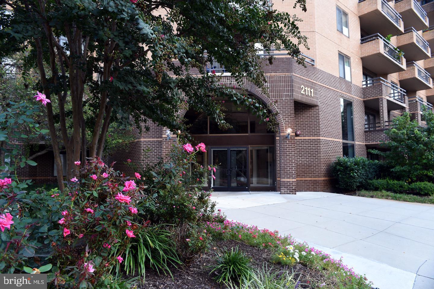 2111 Wisconsin Avenue Northwest, Unit 402 Washington, DC 20007 - Photo 1 of 22 a view of flower garden in front of house