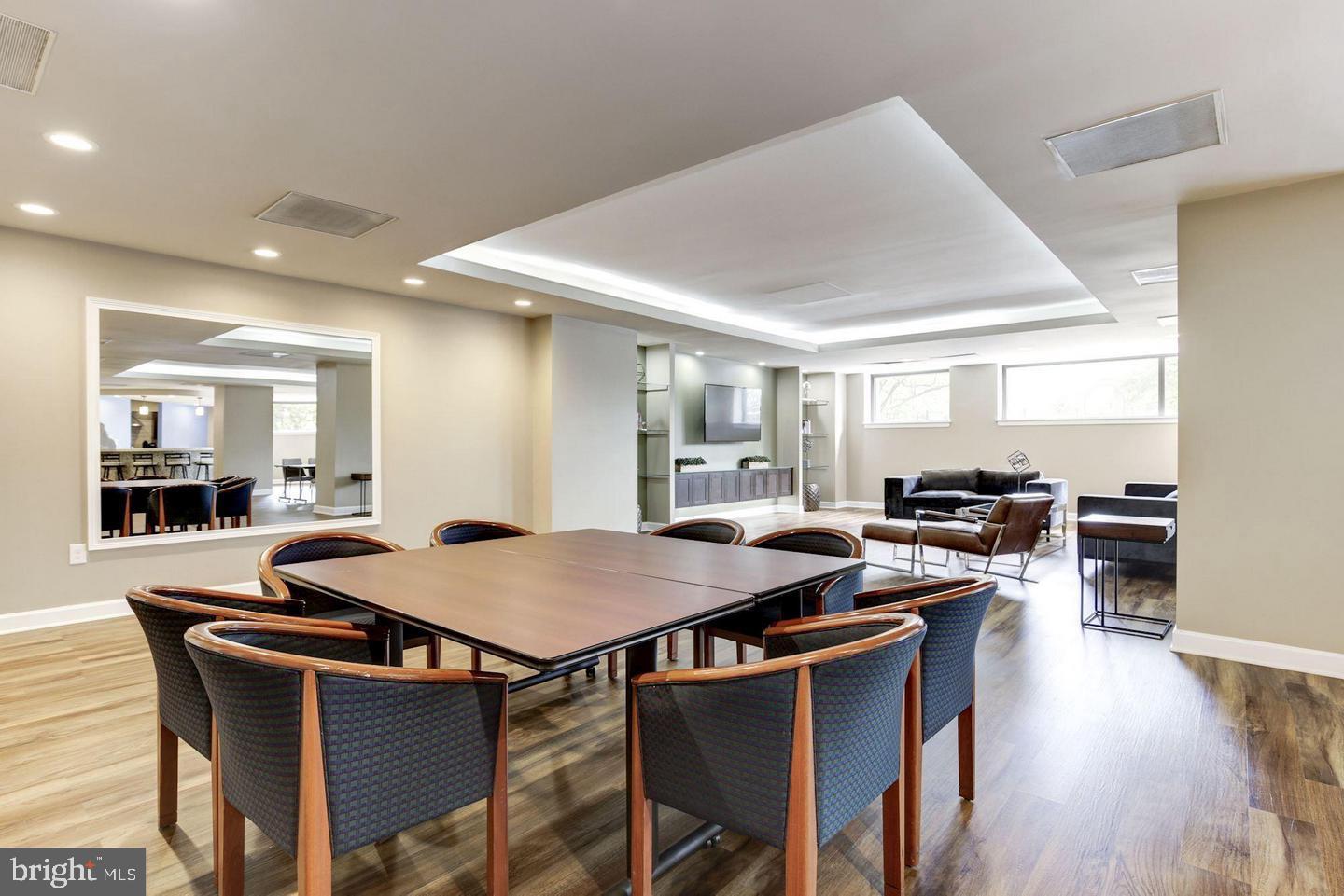 2111 Wisconsin Avenue Northwest, Unit 402 Washington, DC 20007 - Photo 20 of 22 a kitchen with a table and chairs in it