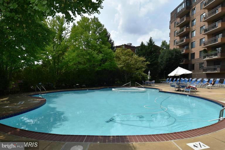2111 Wisconsin Avenue Northwest, Unit 402 Washington, DC 20007 - Photo 21 of 22 a view of a swimming pool with a patio