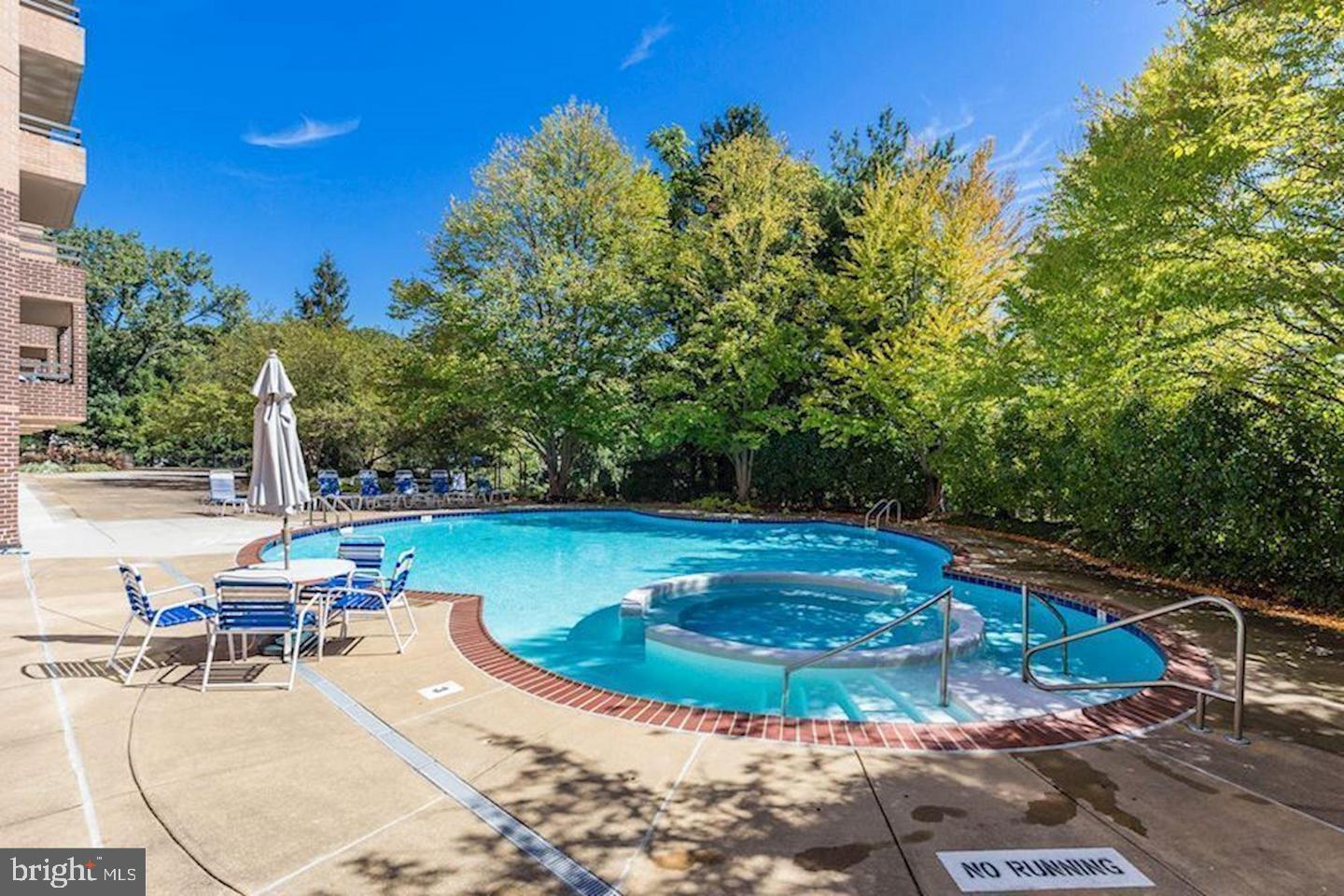 2111 Wisconsin Avenue Northwest, Unit 402 Washington, DC 20007 - Photo 22 of 22 a view of a swimming pool with lounge chair