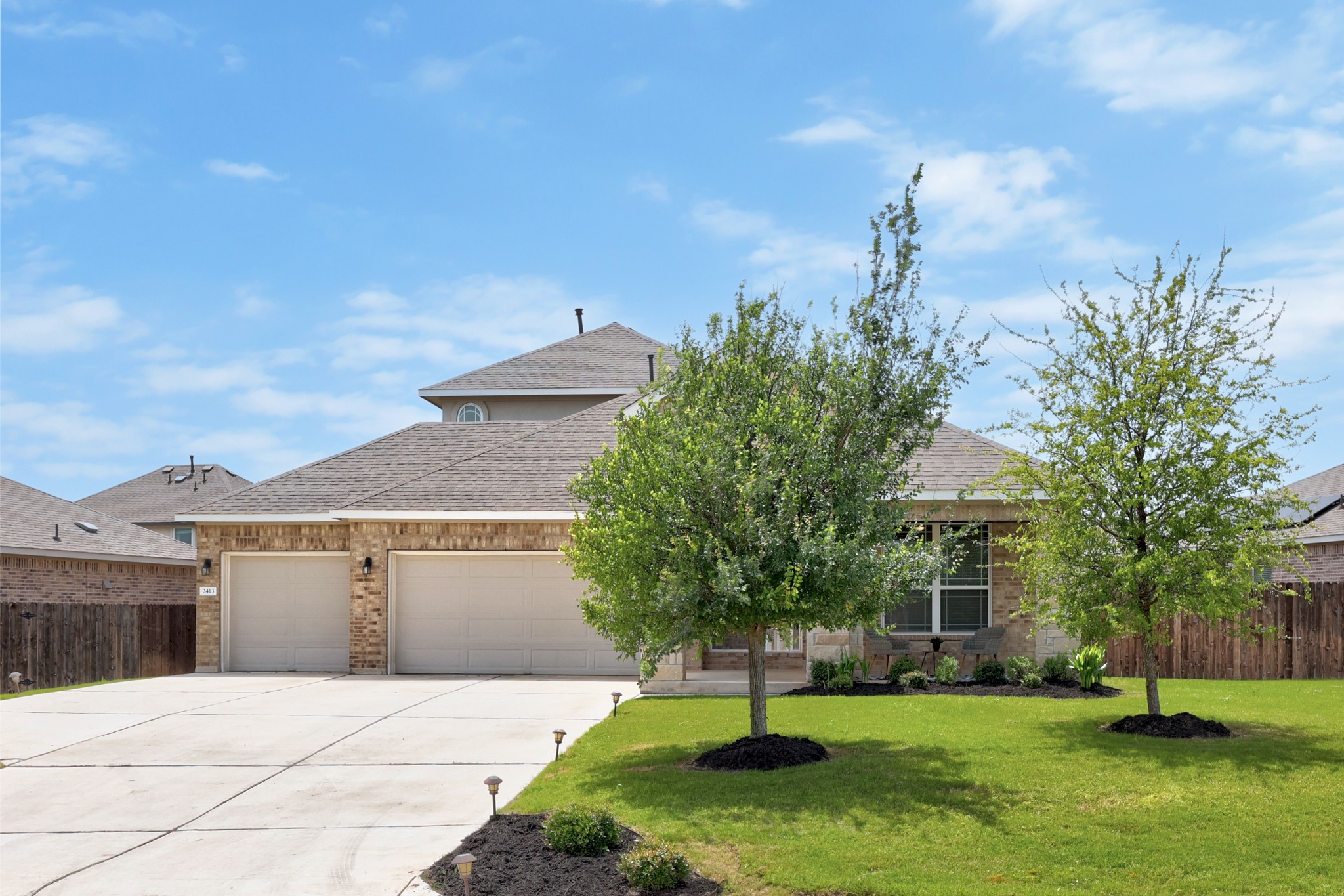 2413 Starhill Ranch Street Georgetown, TX 78628 - Photo 2 of 40 a view of a patio with a yard