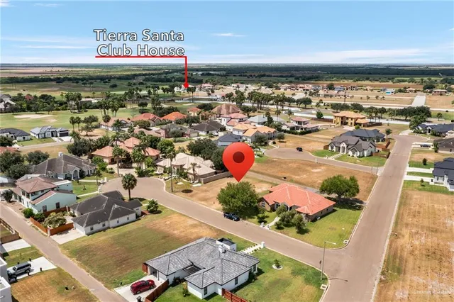 an aerial view of residential houses and outdoor space