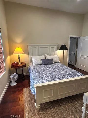 a bedroom with a bed and dresser