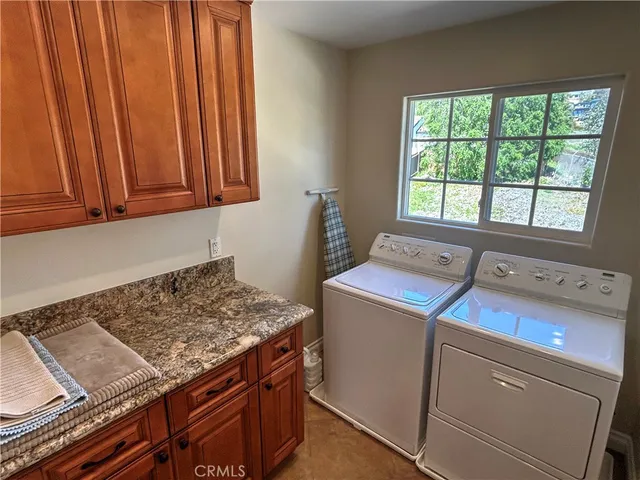 a bed sitting in a room next to a larger window