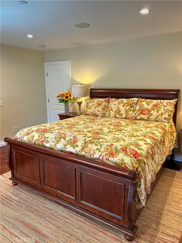 a bed room with a bed and a night stand