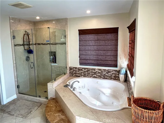 a view of a livingroom with workspace and a couch