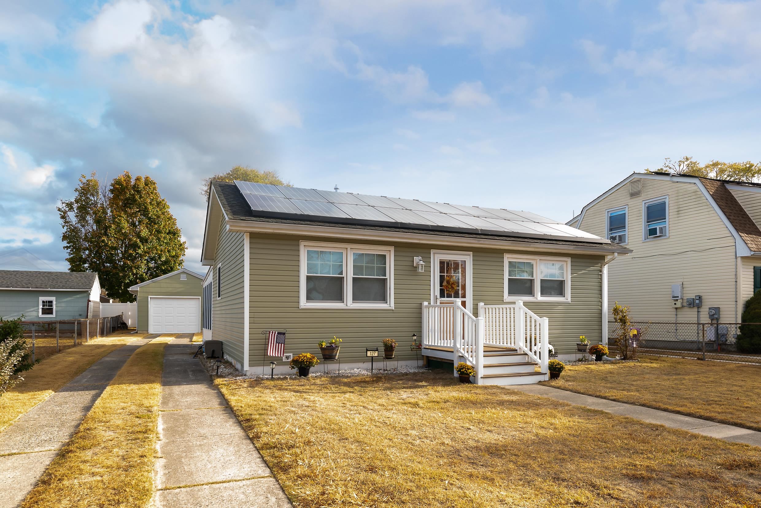 a front view of a house with a patio