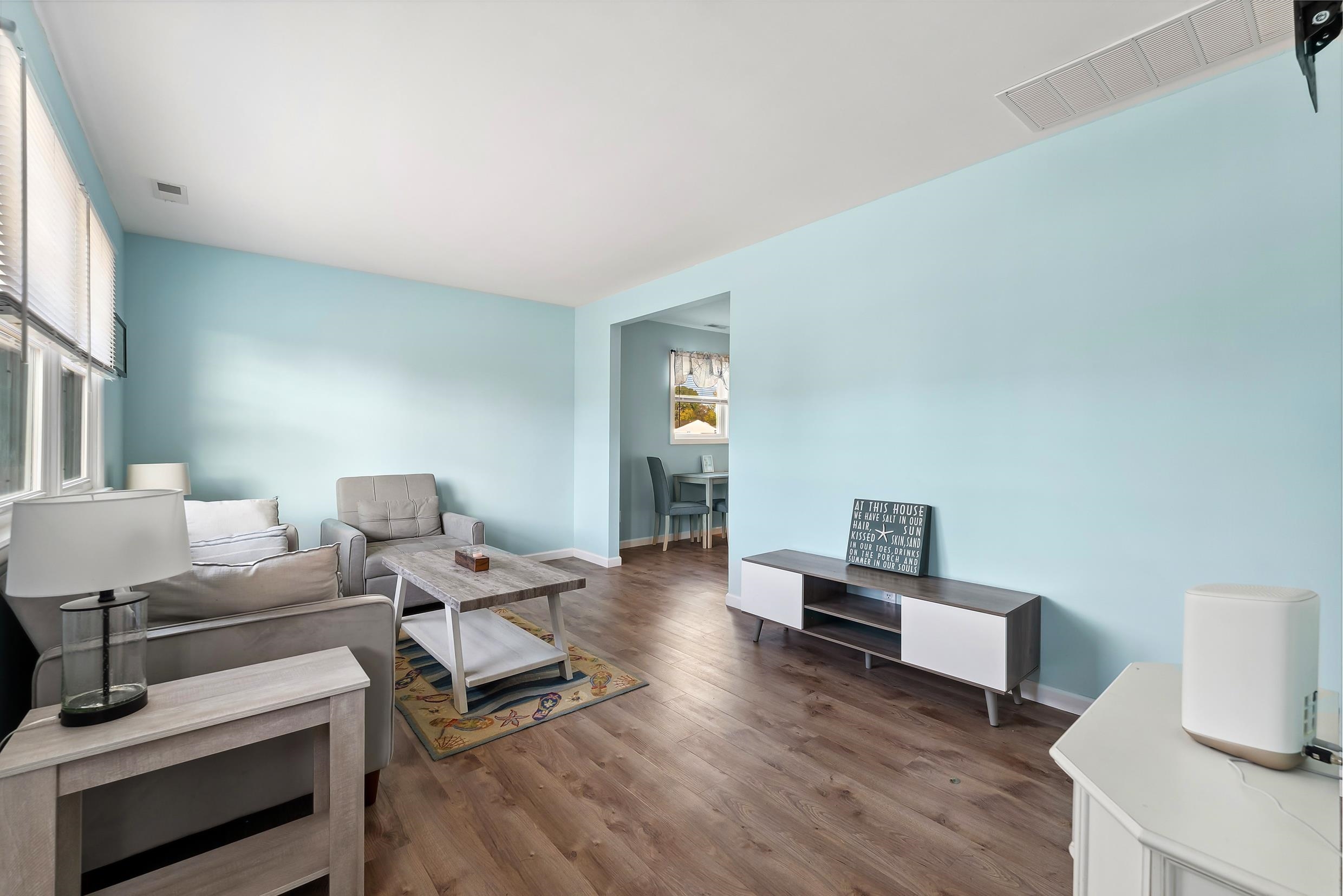 127 Broadway Villas, NJ 08251 - Photo 12 of 30 a living room with furniture and a wooden floor