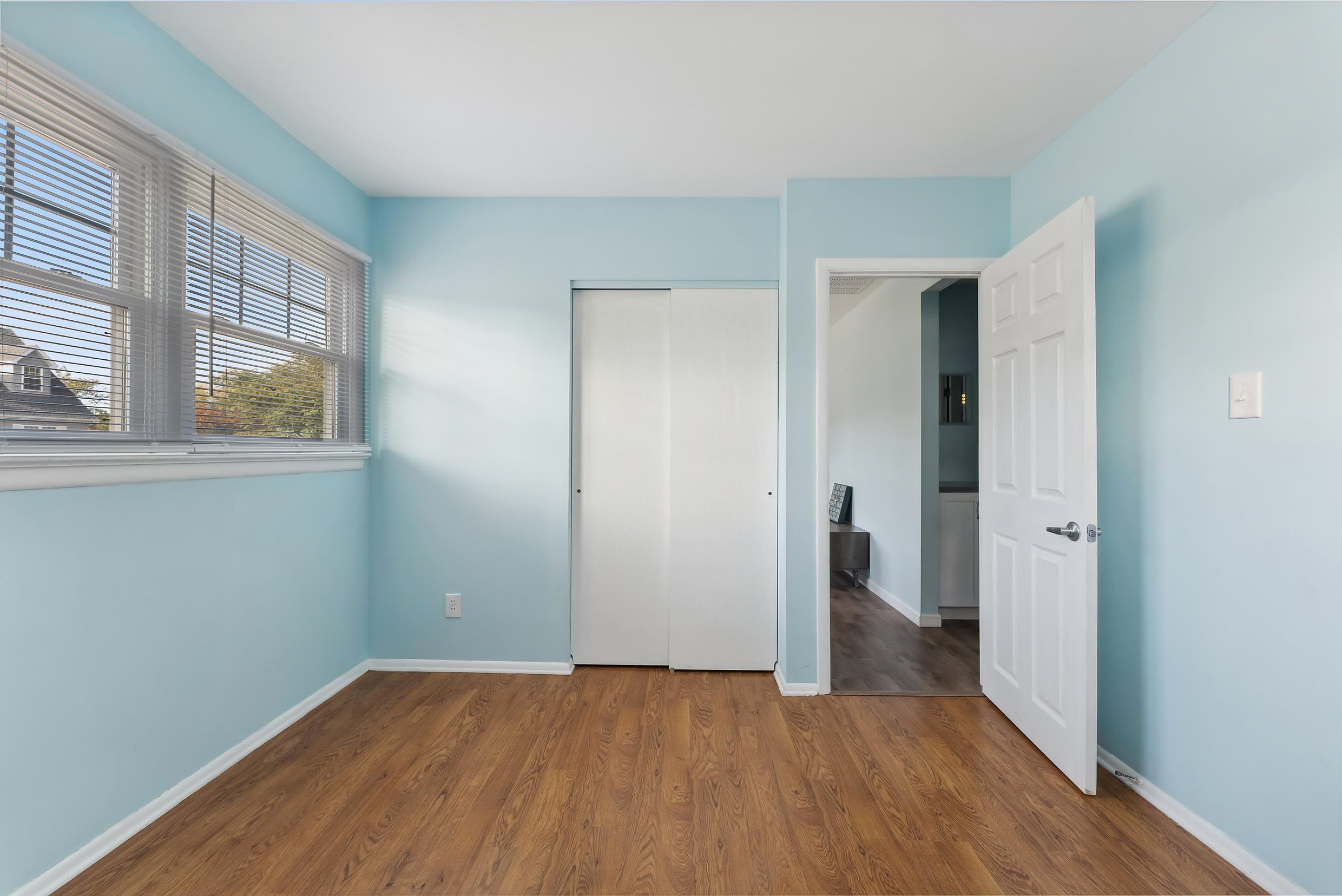 127 Broadway Villas, NJ 08251 - Photo 23 of 30 a view of an empty room with wooden floor and a window
