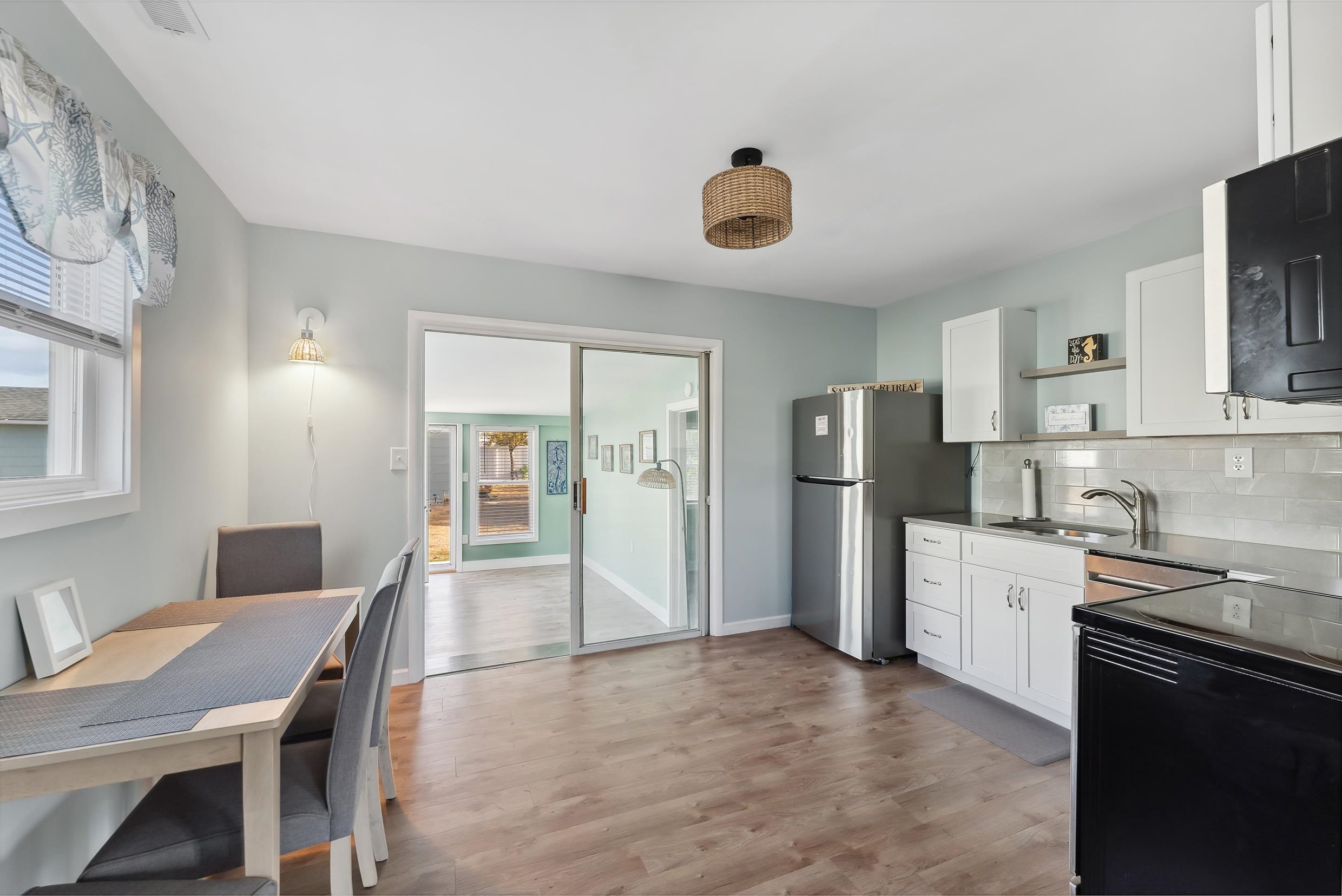 127 Broadway Villas, NJ 08251 - Photo 6 of 30 a kitchen with stainless steel appliances granite countertop a refrigerator and a stove top oven