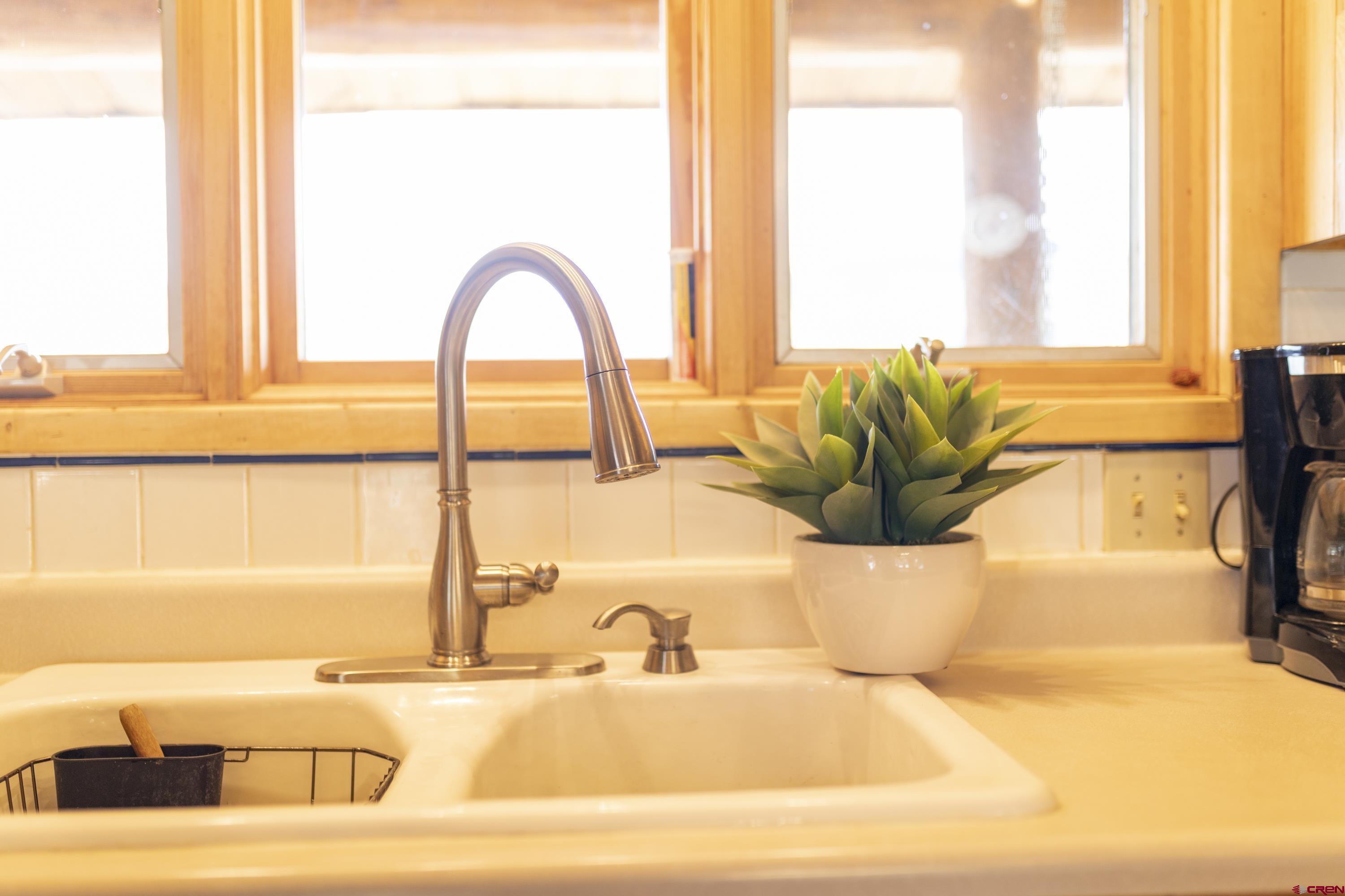 108 Forest Road Creede, CO 81130 - Photo 13 of 32 a bathroom with a tub and a large window