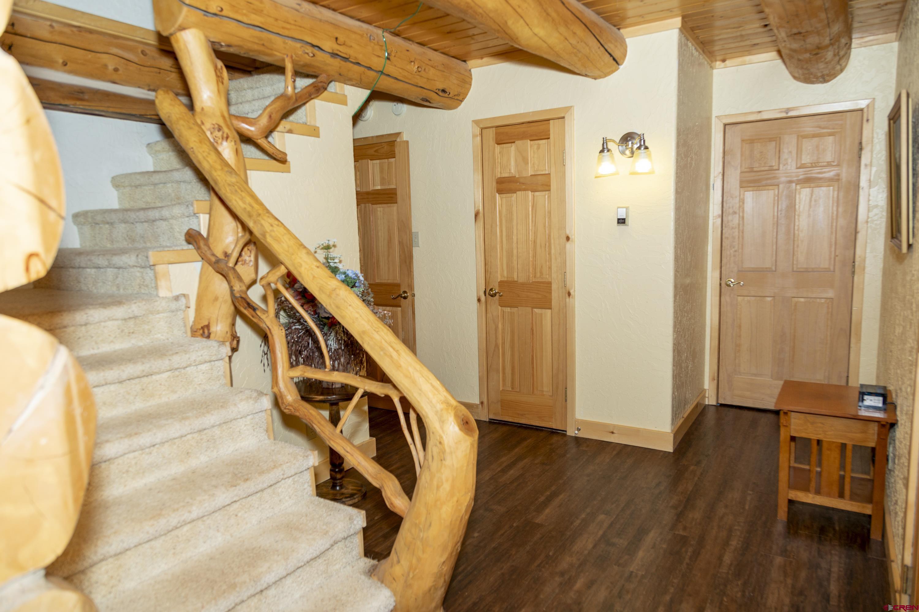 108 Forest Road Creede, CO 81130 - Photo 19 of 32 a view of entryway and hall with wooden floor