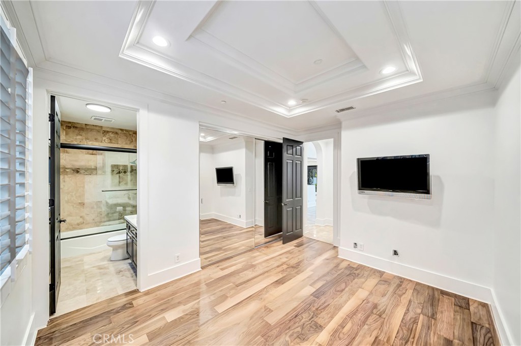 4165 Elm View Encino, CA 91316 - Photo 15 of 49 a view of a livingroom with wooden floor and a flat screen tv