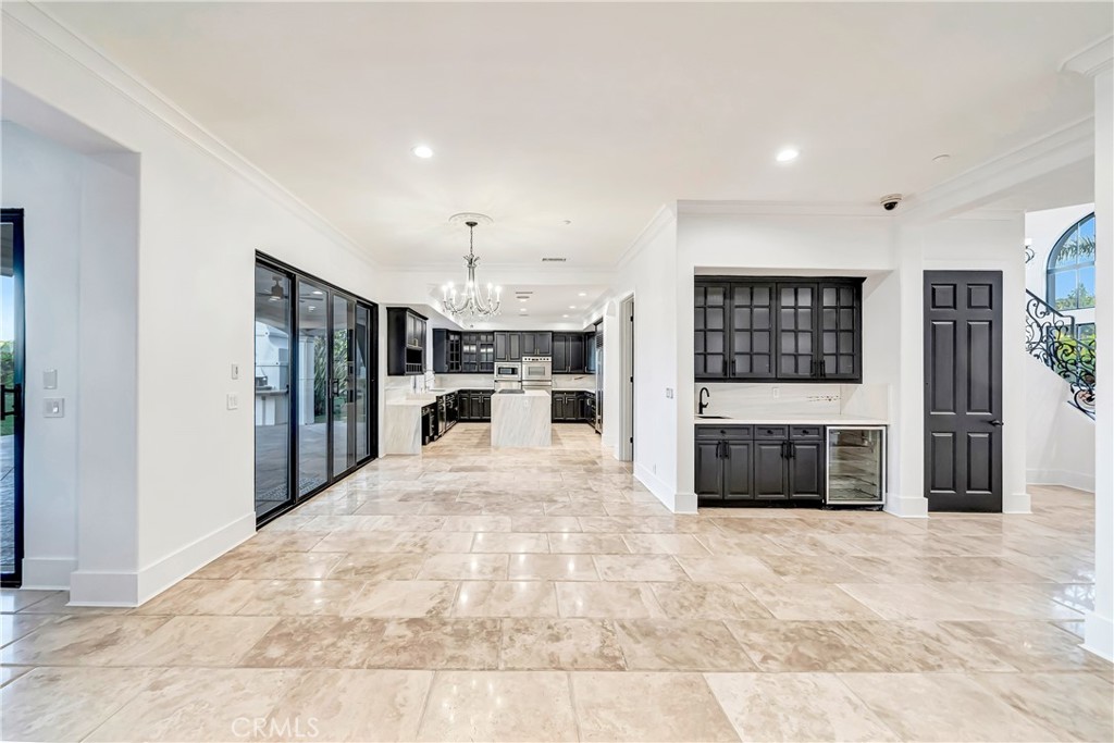 4165 Elm View Encino, CA 91316 - Photo 22 of 49 a large white room with kitchen and fireplace