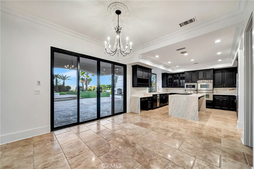 4165 Elm View Encino, CA 91316 - Photo 23 of 49 a view of a kitchen with kitchen island a counter top and stainless steel appliances