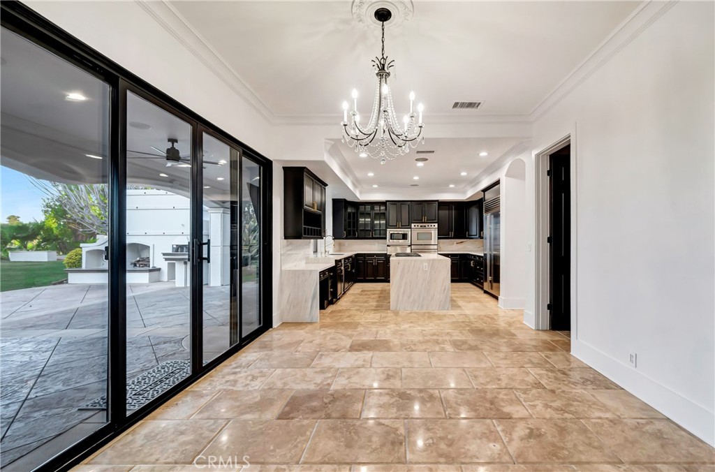 4165 Elm View Encino, CA 91316 - Photo 24 of 49 a view of a kitchen with refrigerator and a floor to ceiling window