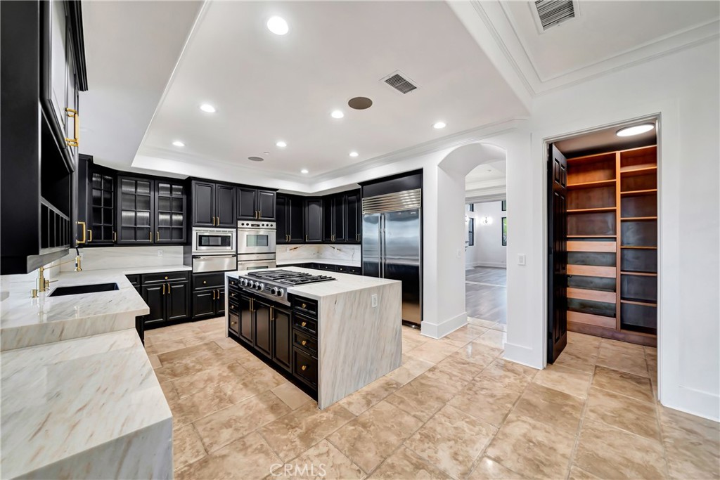 4165 Elm View Encino, CA 91316 - Photo 27 of 49 a large kitchen with stainless steel appliances granite countertop a large counter top and a stove