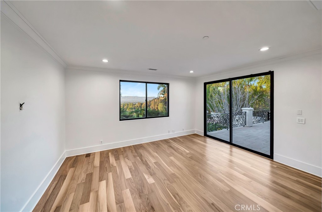 4165 Elm View Encino, CA 91316 - Photo 31 of 49 a view of hallway with a large window and wooden floor