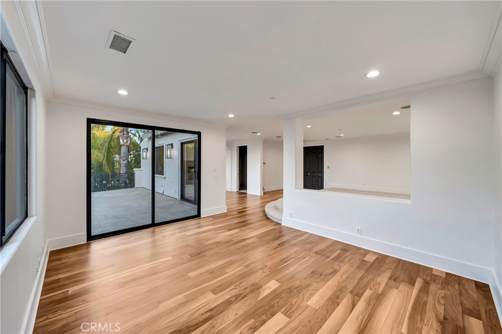 4165 Elm View Encino, CA 91316 - Photo 32 of 49 a view of an empty room with wooden floor and a window