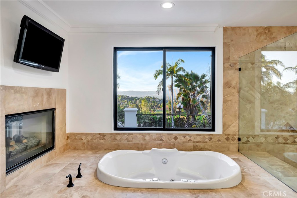 4165 Elm View Encino, CA 91316 - Photo 34 of 49 a bath tub sitting in a bathroom next to a window