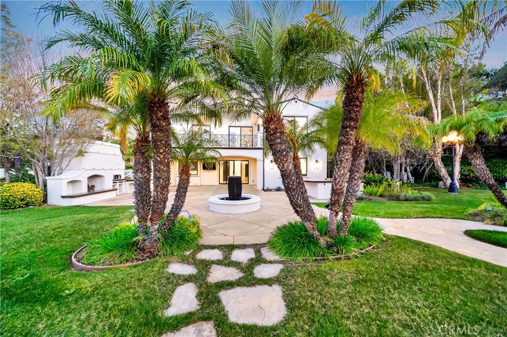 4165 Elm View Encino, CA 91316 - Photo 38 of 49 a front view of a house with garden and trees
