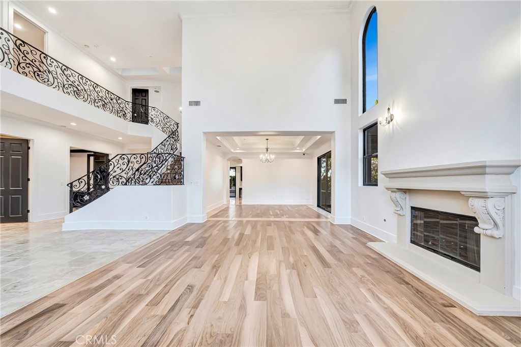 4165 Elm View Encino, CA 91316 - Photo 10 of 49 a view of a living room a hallway with fireplace and wooden floor