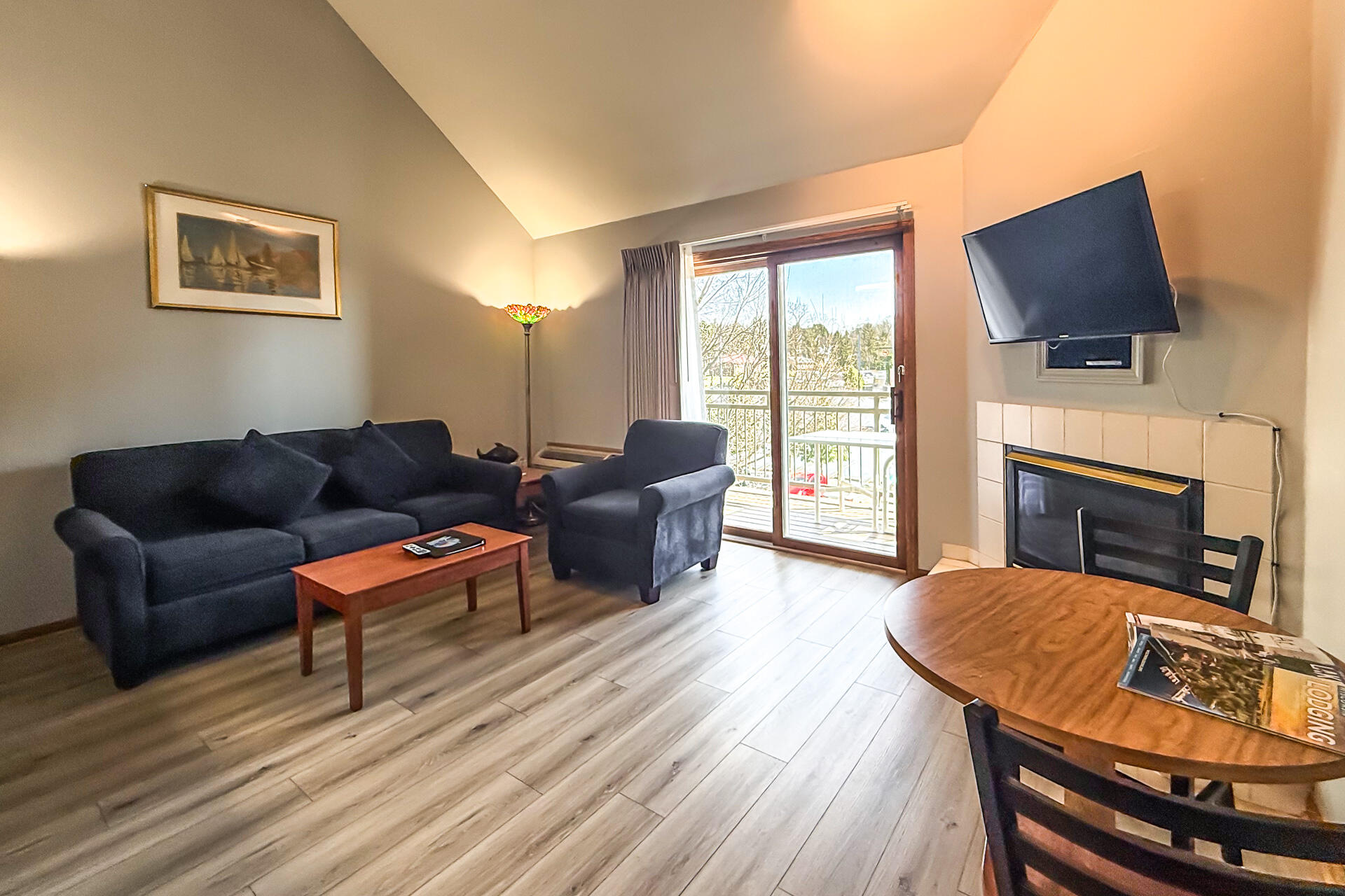 111 Center Street, Unit 403 Lake Geneva, WI 53147 - Photo 3 of 29 Living Room and Balcony
