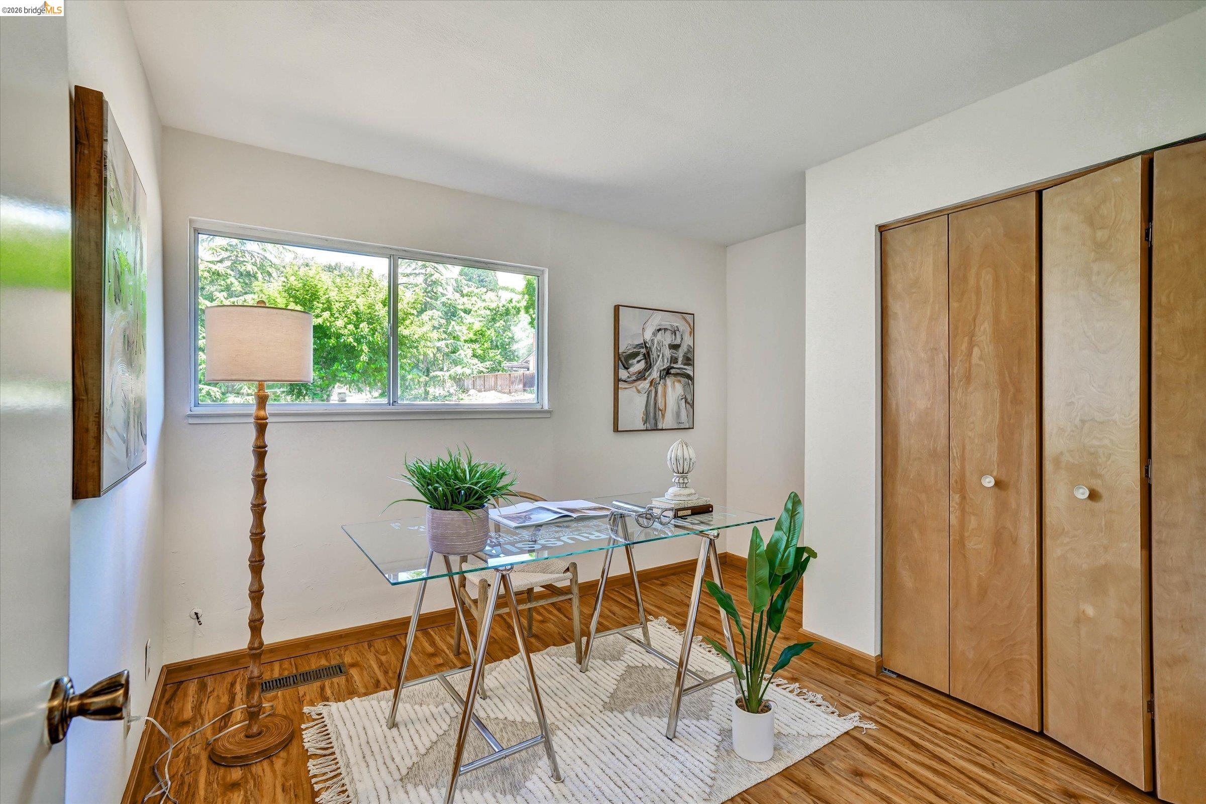 2826 Wright Avenue Pinole, CA 94564 - Photo 23 of 70 Warm wood-finish flooring complements the white wall palette