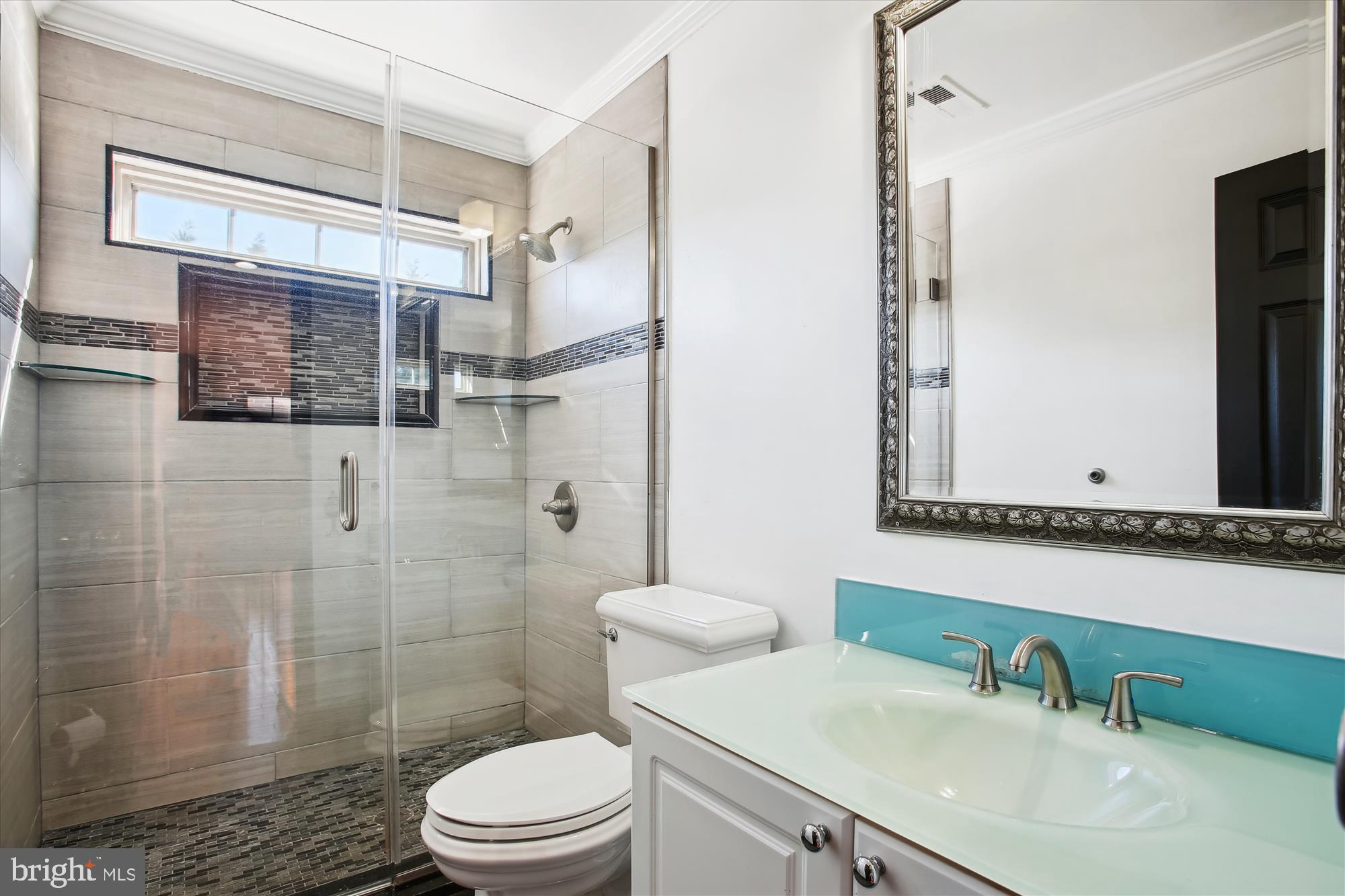 6103 Deer Ridge Trail Springfield, VA 22150 - Photo 11 of 36 a bathroom with a sink toilet and shower