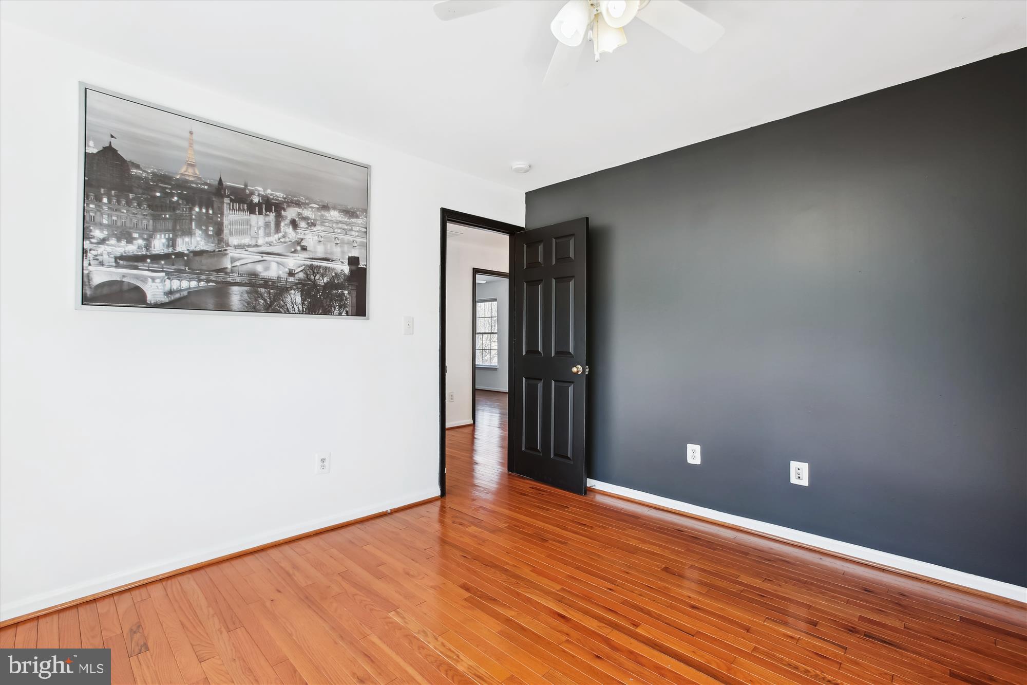 6103 Deer Ridge Trail Springfield, VA 22150 - Photo 14 of 36 a view of an empty room with wooden floor