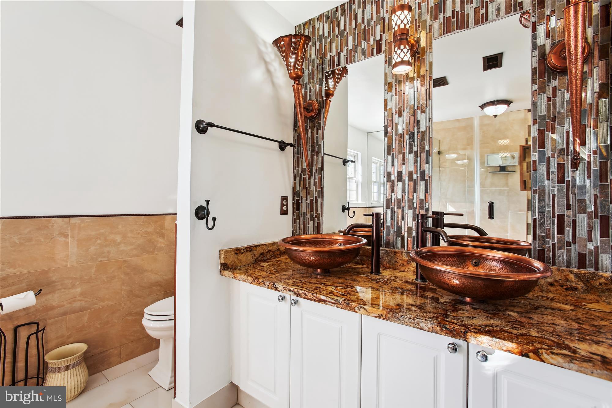 6103 Deer Ridge Trail Springfield, VA 22150 - Photo 16 of 36 a bathroom with a granite countertop sink and a toilet
