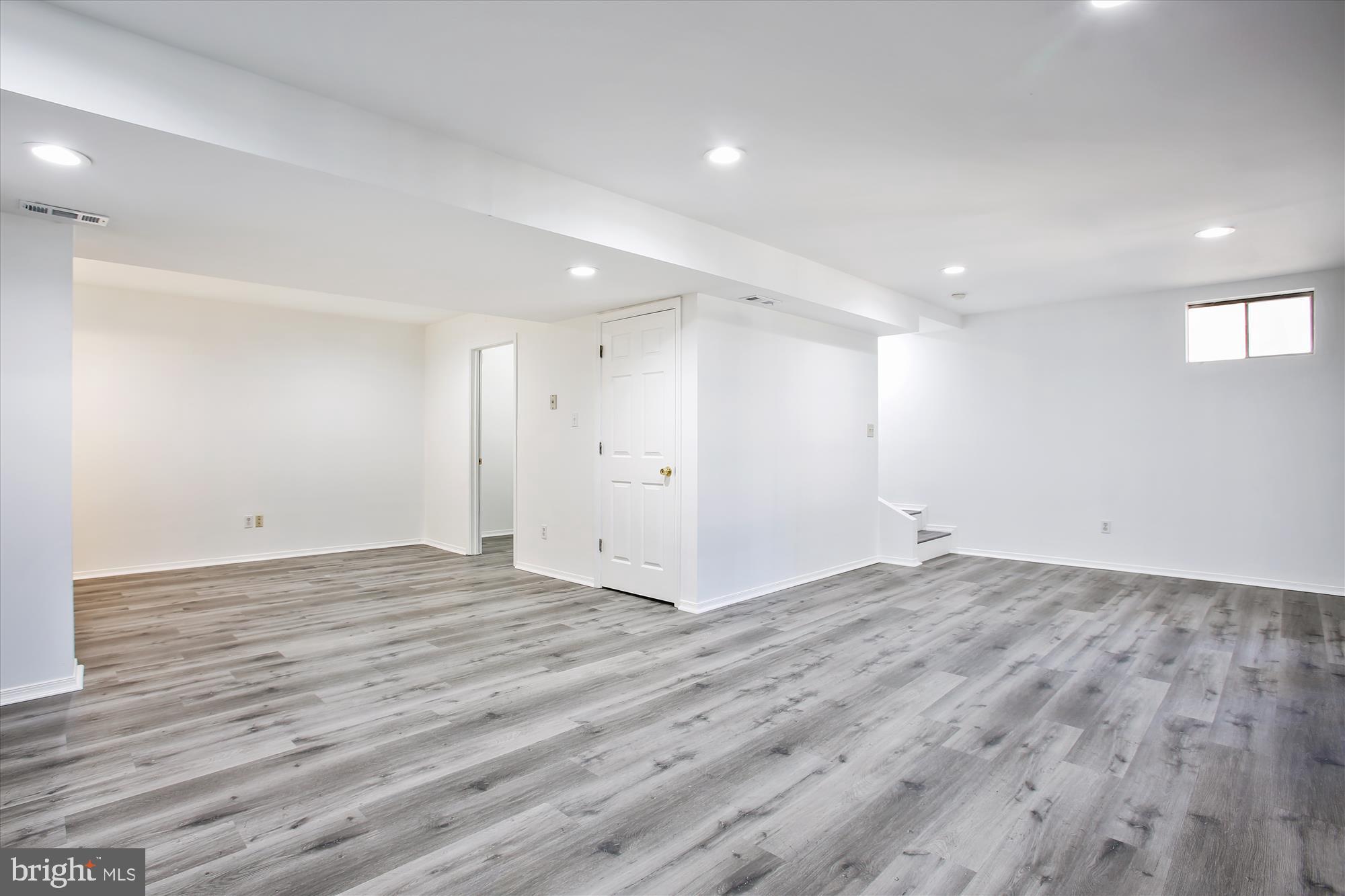 6103 Deer Ridge Trail Springfield, VA 22150 - Photo 18 of 36 a view of an empty room with wooden floor