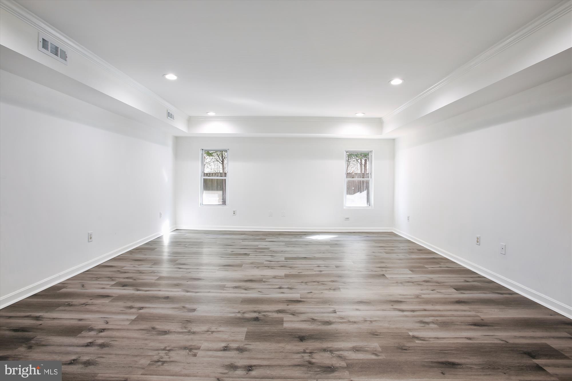 6103 Deer Ridge Trail Springfield, VA 22150 - Photo 20 of 36 a view of empty room with wooden floor and fan