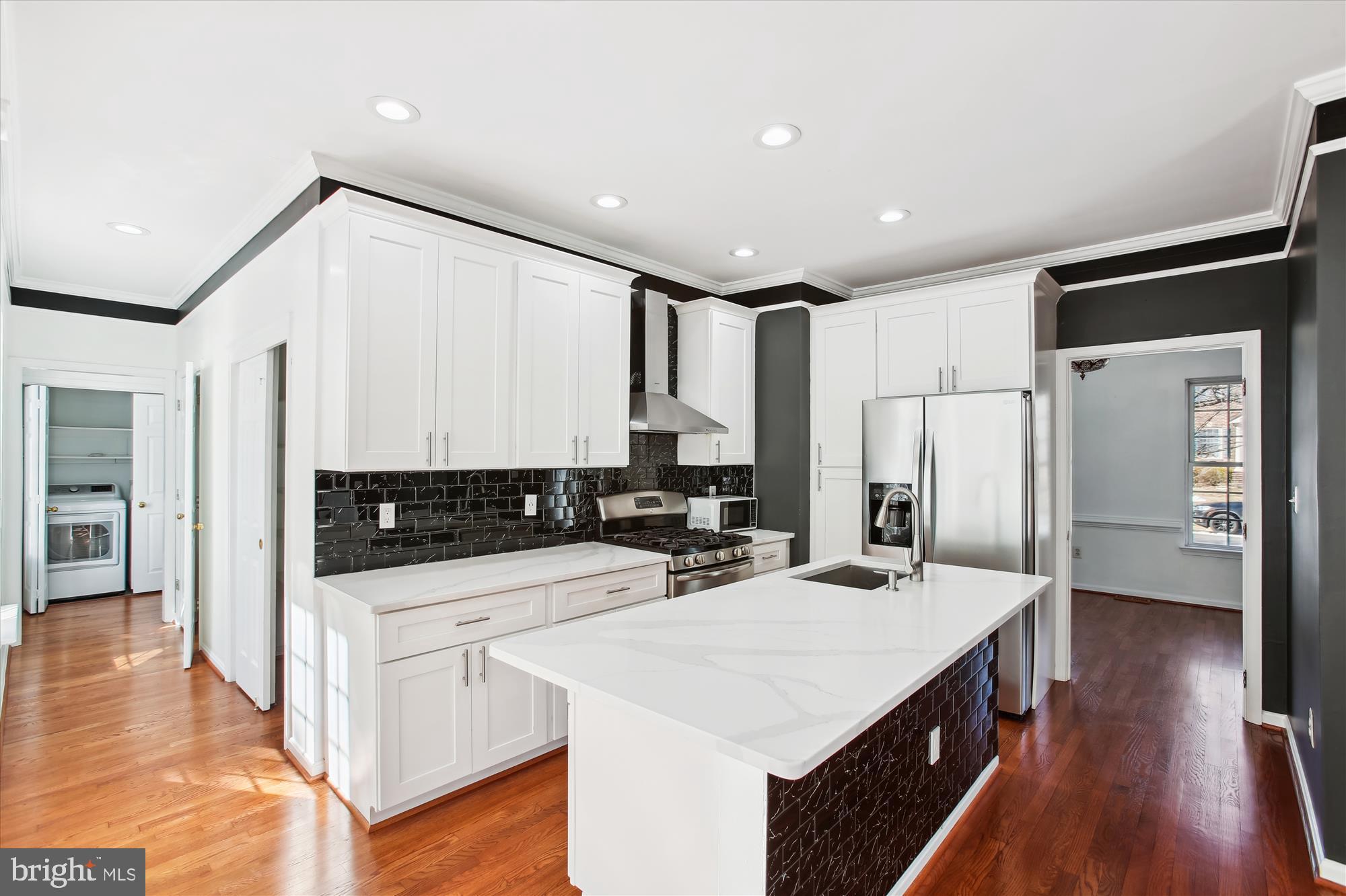 6103 Deer Ridge Trail Springfield, VA 22150 - Photo 2 of 36 a kitchen with stainless steel appliances a sink a stove a refrigerator and cabinets