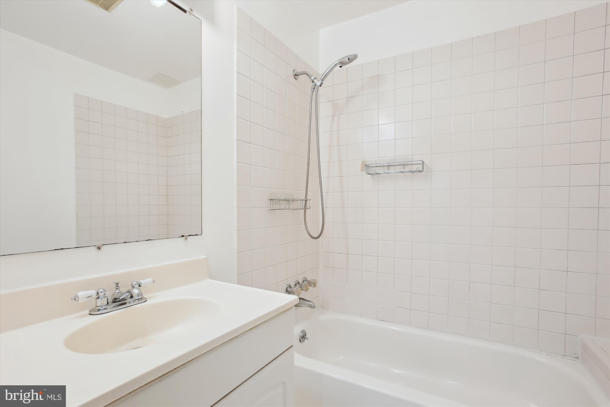 6103 Deer Ridge Trail Springfield, VA 22150 - Photo 22 of 36 a bathroom with a bathtub and a sink