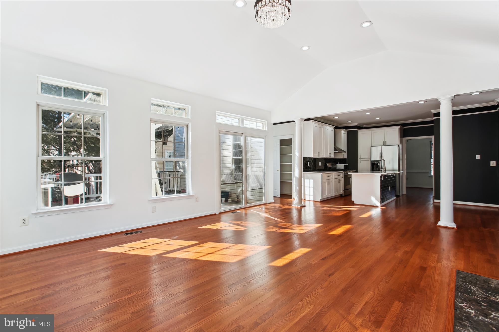 6103 Deer Ridge Trail Springfield, VA 22150 - Photo 4 of 36 a view of a livingroom with furniture wooden floor and windows